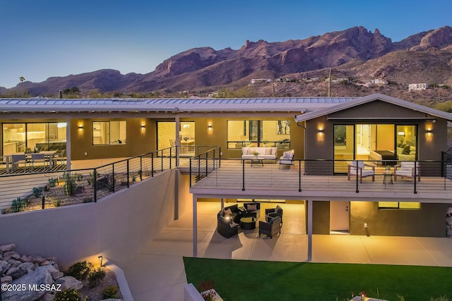 6800 N Cocopas Rd, Tucson, AZ 85718 - rear view of house featuring a mountain view, outdoor lounge area, a patio, stucco siding, and a balcony