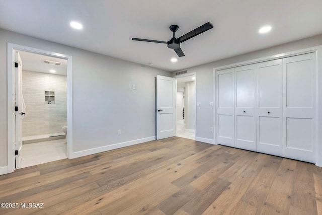 6800 N Cocopas Rd, Tucson, AZ 85718 - unfurnished bedroom with light wood-type flooring, recessed lighting, connected bathroom, a closet, and baseboards