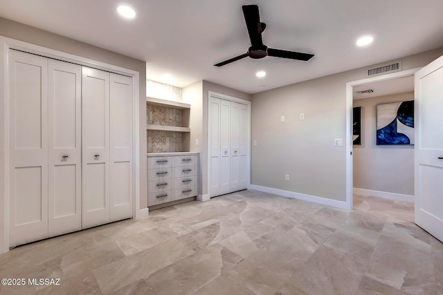 6800 N Cocopas Rd, Tucson, AZ 85718 - unfurnished bedroom featuring multiple closets, recessed lighting, baseboards, and ceiling fan