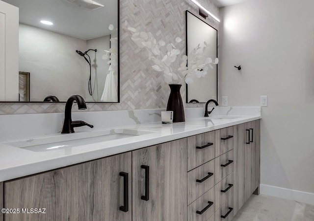6800 N Cocopas Rd, Tucson, AZ 85718 - full bathroom featuring double vanity, a shower, decorative backsplash, and baseboards