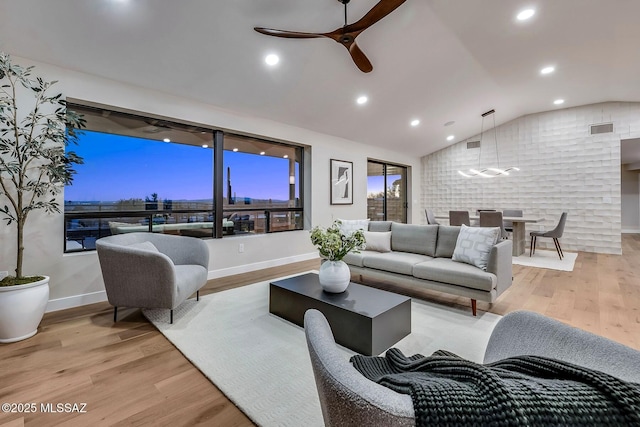 6800 N Cocopas Rd, Tucson, AZ 85718 - living room with a ceiling fan, light wood-type flooring, vaulted ceiling, recessed lighting, and baseboards