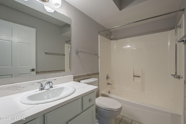 full bath featuring toilet, shower / bath combination, tile patterned floors, and vanity