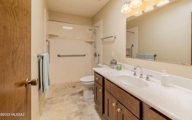 full bath featuring vanity, walk in shower, and toilet