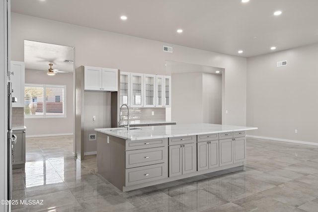 2891 N Wentworth Rd, Tucson, AZ 85749 - kitchen featuring marble finish floor, a ceiling fan, a sink, and visible vents