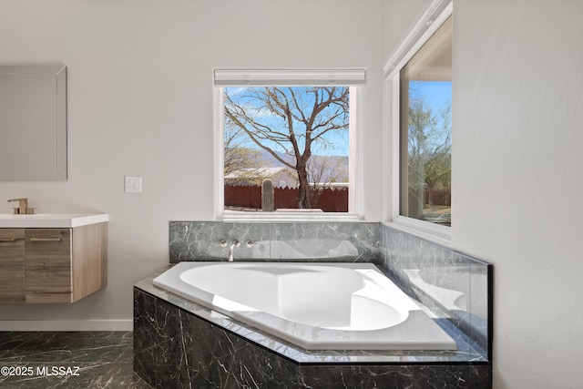 2891 N Wentworth Rd, Tucson, AZ 85749 - full bath featuring marble finish floor, vanity, baseboards, and a bath