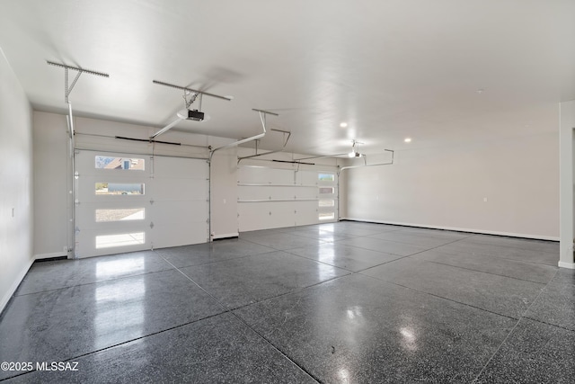 2891 N Wentworth Rd, Tucson, AZ 85749 - garage featuring baseboards and a garage door opener