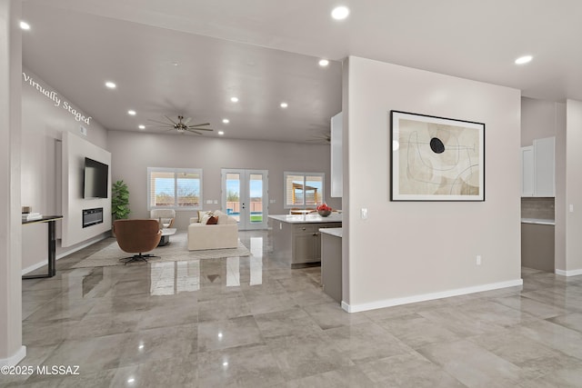 2891 N Wentworth Rd, Tucson, AZ 85749 - unfurnished living room featuring baseboards, ceiling fan, and recessed lighting