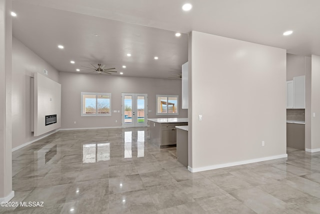 2891 N Wentworth Rd, Tucson, AZ 85749 - unfurnished living room with baseboards, ceiling fan, french doors, and recessed lighting