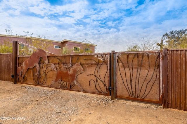 view of gate with fence