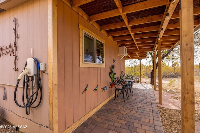 view of patio / terrace with a wall unit AC