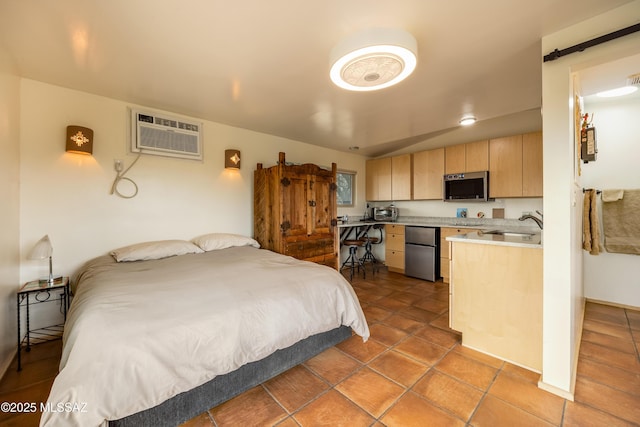 tiled bedroom with a sink, freestanding refrigerator, and a wall mounted air conditioner
