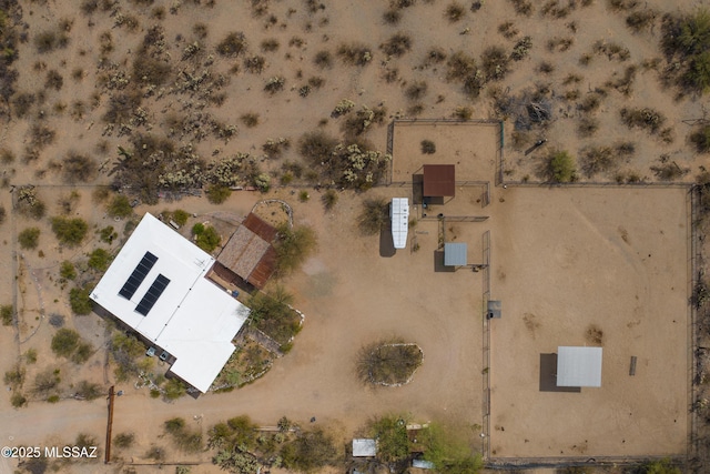 drone / aerial view featuring a desert view