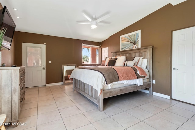 bedroom featuring a ceiling fan, light tile patterned flooring, baseboards, and vaulted ceiling