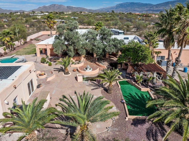 birds eye view of property with a mountain view