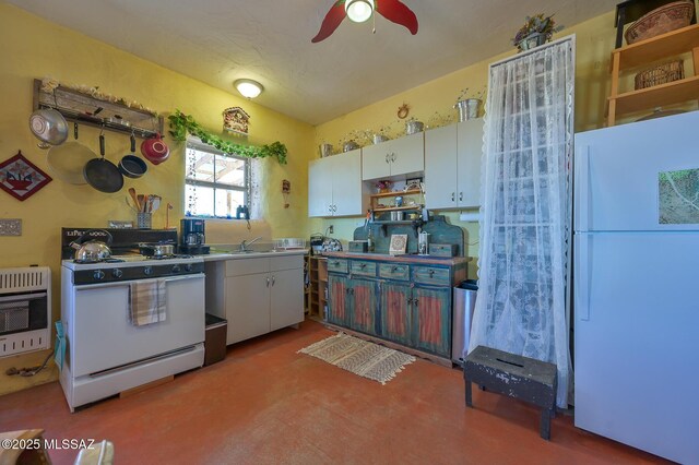 kitchen featuring heating unit, open shelves, a ceiling fan, white appliances, and white cabinetry