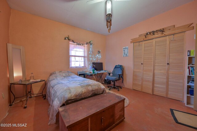 carpeted bedroom with a closet and ceiling fan