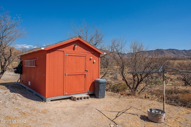 view of shed with a mountain view