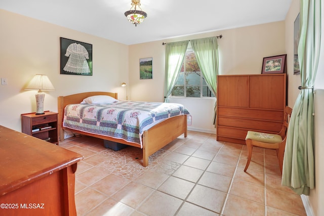 bedroom with light tile patterned floors