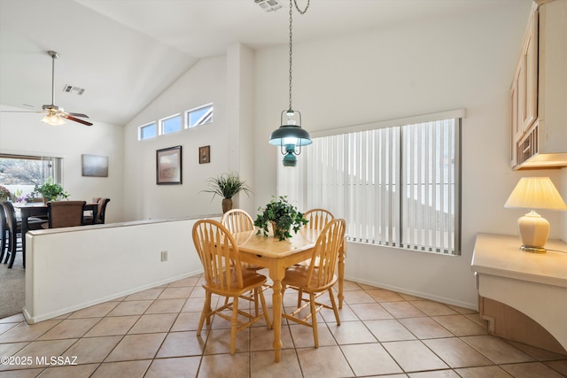 dining room with high vaulted ceiling, ceiling fan, baseboards, and light tile patterned flooring