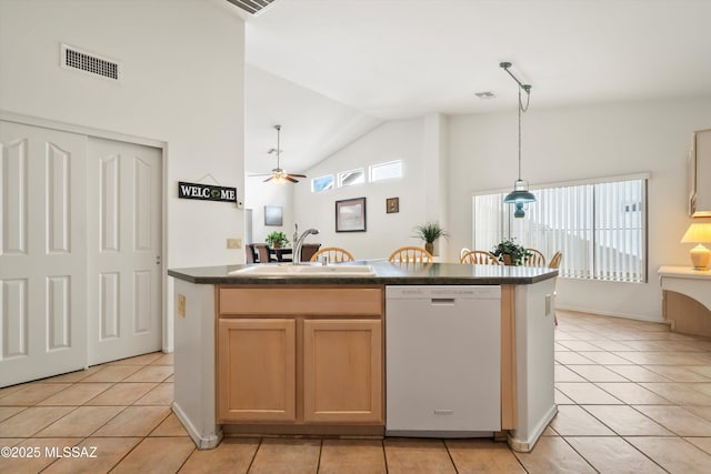 kitchen with visible vents, dishwasher, a sink, a ceiling fan, and dark countertops