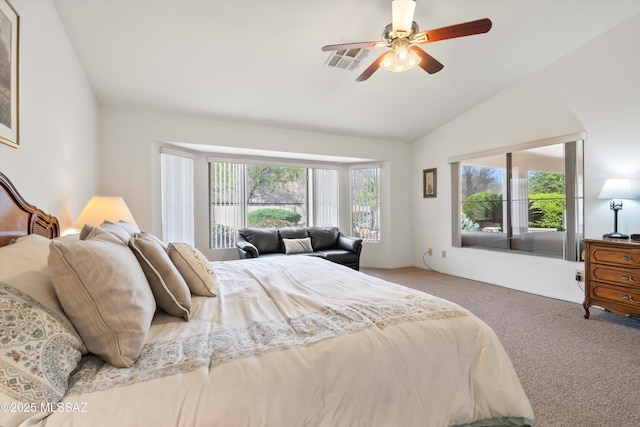 carpeted bedroom with visible vents, ceiling fan, and lofted ceiling
