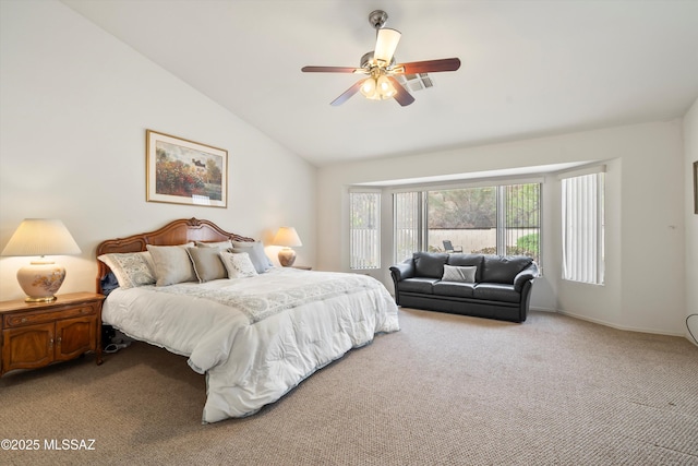 bedroom with visible vents, baseboards, a ceiling fan, light carpet, and lofted ceiling