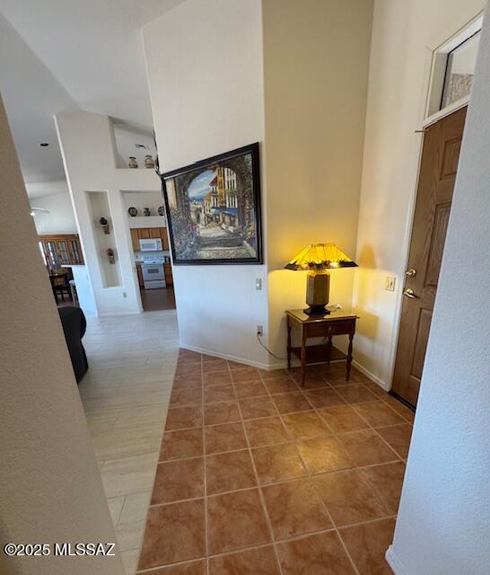 4769 S Meadow Ridge Dr, Green Valley, AZ 85622 - corridor with tile patterned floors, baseboards, and built in features