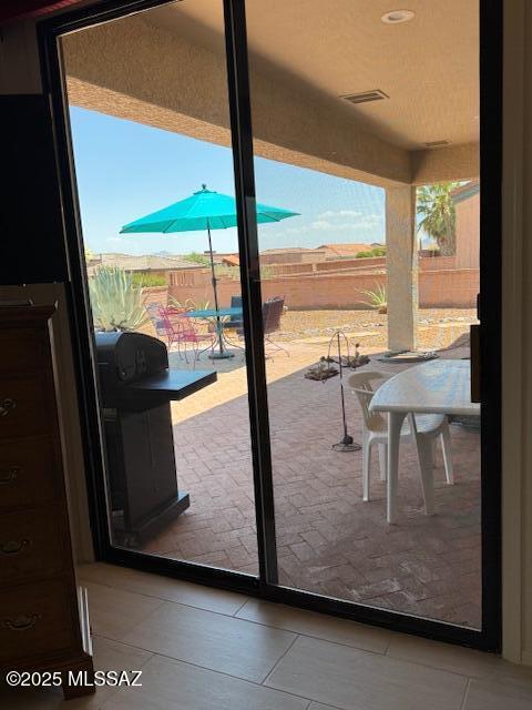 4769 S Meadow Ridge Dr, Green Valley, AZ 85622 - doorway with tile patterned floors