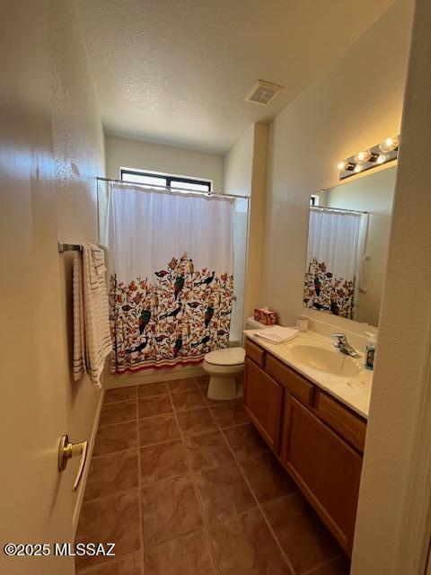 4769 S Meadow Ridge Dr, Green Valley, AZ 85622 - full bathroom featuring vanity, toilet, and tile patterned flooring
