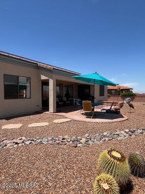 4769 S Meadow Ridge Dr, Green Valley, AZ 85622 - rear view of house with a patio