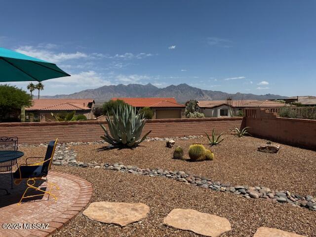 4769 S Meadow Ridge Dr, Green Valley, AZ 85622 - fenced backyard with a mountain view