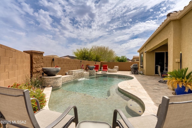 view of swimming pool with a fenced in pool, a patio, a fenced backyard, and a grill