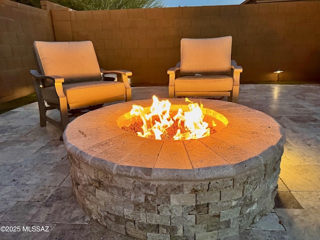 view of patio with a fire pit