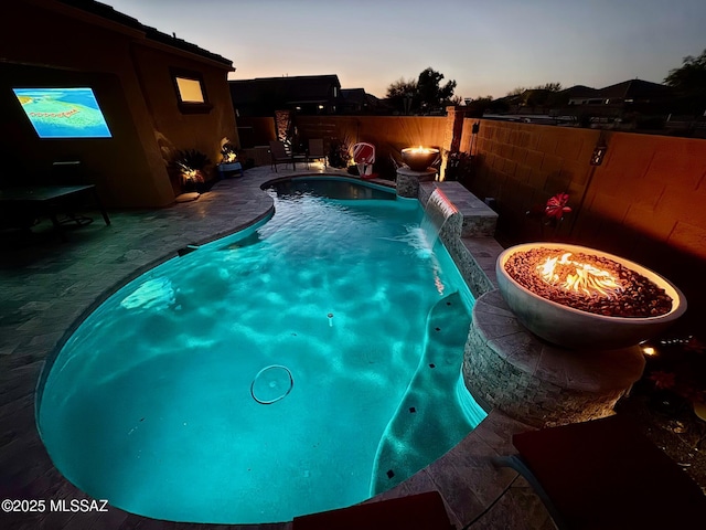 view of swimming pool featuring a patio, a fenced backyard, and a fenced in pool