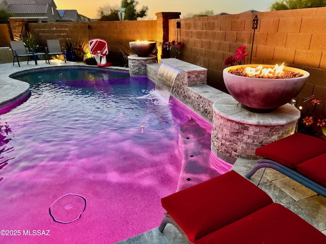 view of swimming pool featuring fence, a fenced in pool, and a patio