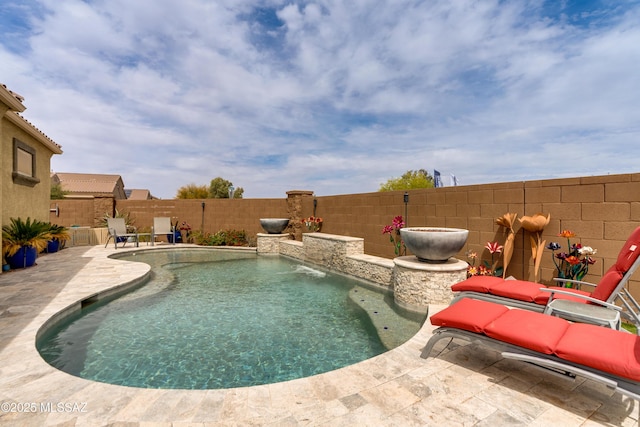 view of swimming pool featuring a fenced in pool, a patio area, and a fenced backyard