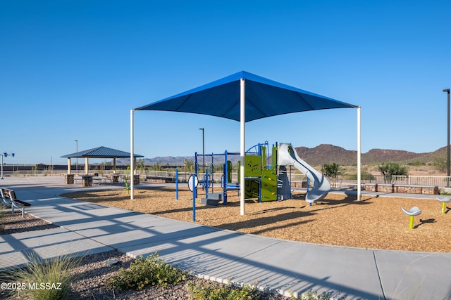 communal playground with a gazebo and a mountain view