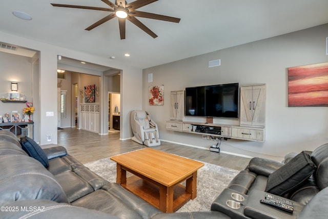 living room featuring recessed lighting, visible vents, a ceiling fan, and wood finished floors
