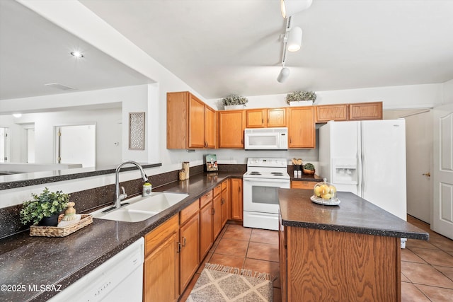 3398 W Sagebrush Hills Ct, Tucson, AZ 85741 - kitchen featuring white appliances, light tile patterned floors, rail lighting, and a sink