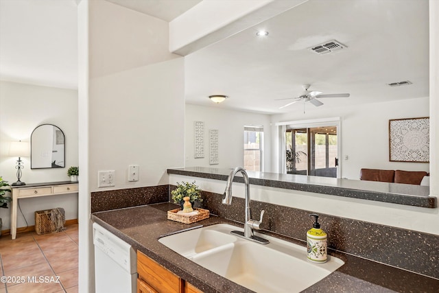 3398 W Sagebrush Hills Ct, Tucson, AZ 85741 - kitchen with white dishwasher, ceiling fan, visible vents, and a sink