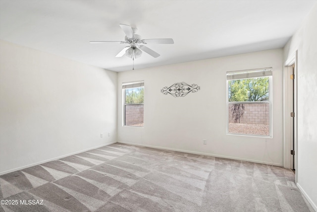 3398 W Sagebrush Hills Ct, Tucson, AZ 85741 - carpeted spare room featuring baseboards, ceiling fan, and a healthy amount of sunlight