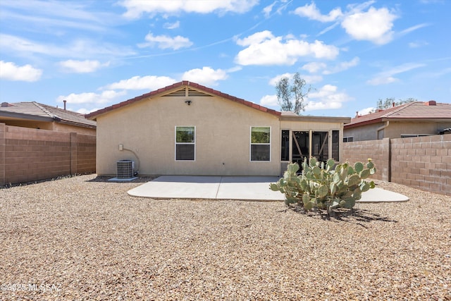 3398 W Sagebrush Hills Ct, Tucson, AZ 85741 - rear view of house featuring a fenced backyard, stucco siding, cooling unit, and a patio area