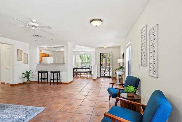 3398 W Sagebrush Hills Ct, Tucson, AZ 85741 - sitting room featuring light tile patterned floors, baseboards, a ceiling fan, and visible vents