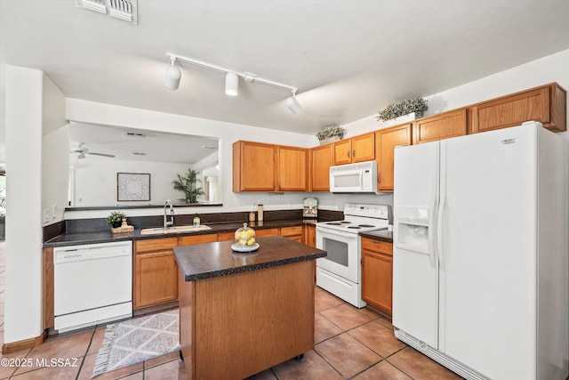 3398 W Sagebrush Hills Ct, Tucson, AZ 85741 - kitchen with white appliances, light tile patterned flooring, dark countertops, and a sink
