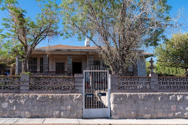 478 W Noon St, Nogales, AZ 85621 - view of front of property featuring a fenced front yard, a gate, and covered porch
