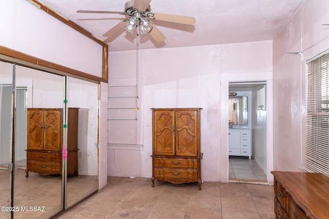 478 W Noon St, Nogales, AZ 85621 - tiled bedroom with a closet, a ceiling fan, and ensuite bathroom