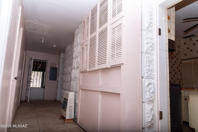 478 W Noon St, Nogales, AZ 85621 - hallway with heating unit, electric panel, and tile patterned flooring