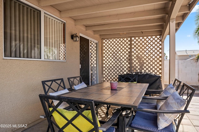 view of patio / terrace featuring fence and outdoor dining space