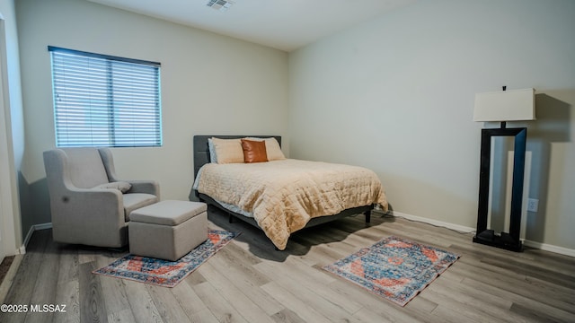 8754 W Denstone Rd, Marana, AZ 85653 - bedroom featuring wood finished floors and baseboards