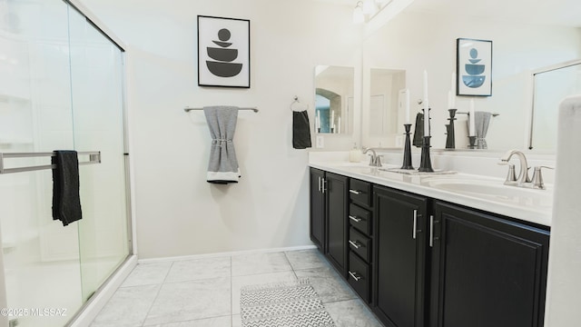 8754 W Denstone Rd, Marana, AZ 85653 - full bathroom featuring double vanity, baseboards, a stall shower, and marble finish flooring